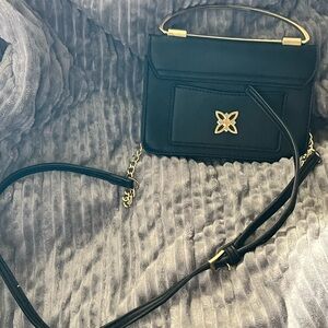 Elegant Authentic Black BCBG Generation Handbag with Gold Accents